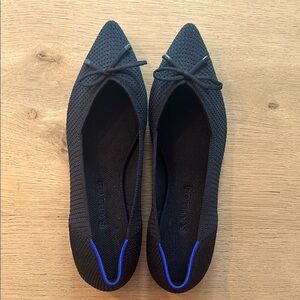 Like New Rothy’s pointed Toe Black Ballet Flat with Bow
